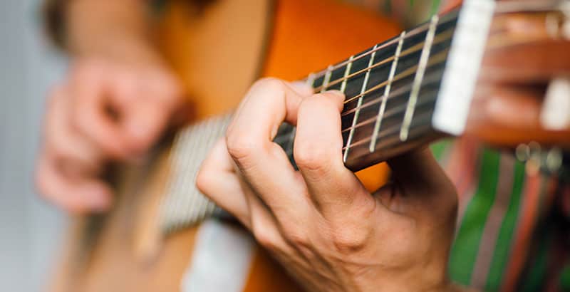 How Hard Should You Hold Down Guitar Strings Guitar Aficionado